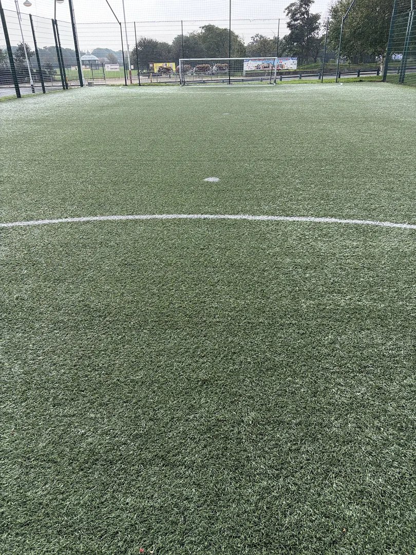 A 3G pitch freshly groomed after a maintenance visit